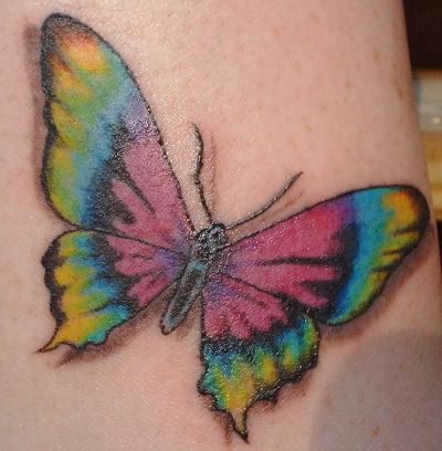 Rainbow coloured butterfly tattoo