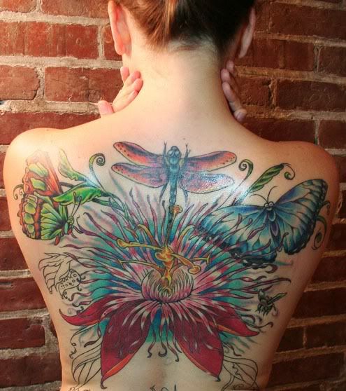 Tattoos Of Flowers And Butterflies. Full back tattoo featuring