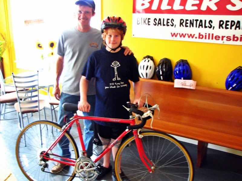 e With his new bike & the owner of the bike shop we use.