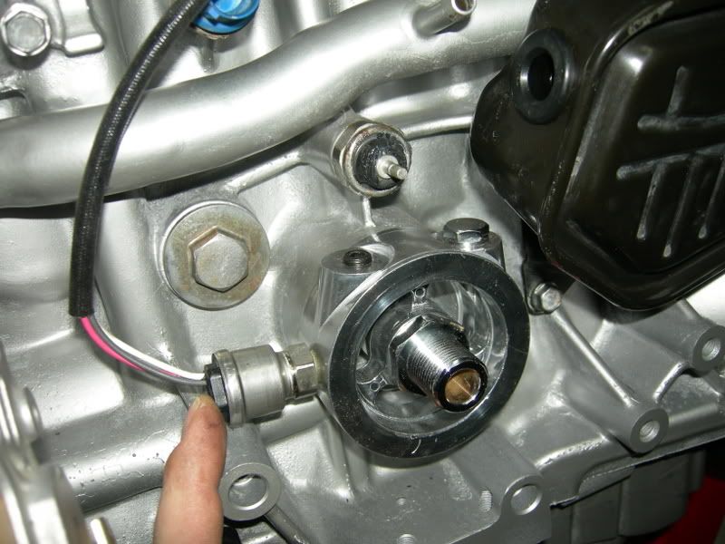 oil gauge hook up There is a 1/8npt tapped hole at the rear rail behind the intake manifold there is a 1/4npt tapped hole just above the oil filter. oil gauge hook up There is a 1/8npt tapped hole at the rear rail behind the intake manifold there is a 1/4npt tapped hole just above the oil filter.