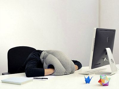 Nap at your desk with the Ostrich Pillow Nap at your desk with the Ostrich Pillow