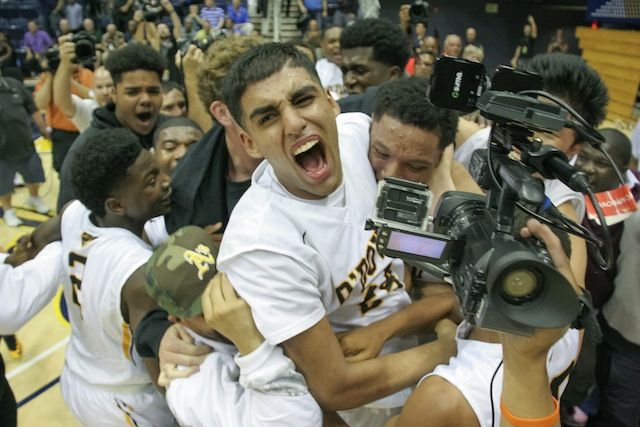 Jeevin Sandhu shouts in glee during the championship celebration