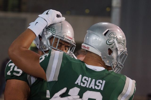 De La Salle defensive stars Boss Tagaloa, left, and Devin Asiasi share a moment in the Open Div. State Bowl