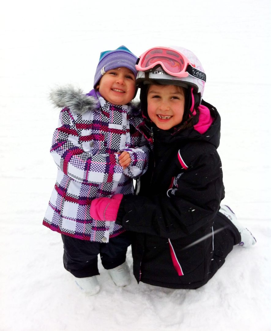 Adorable children on a family ski trip