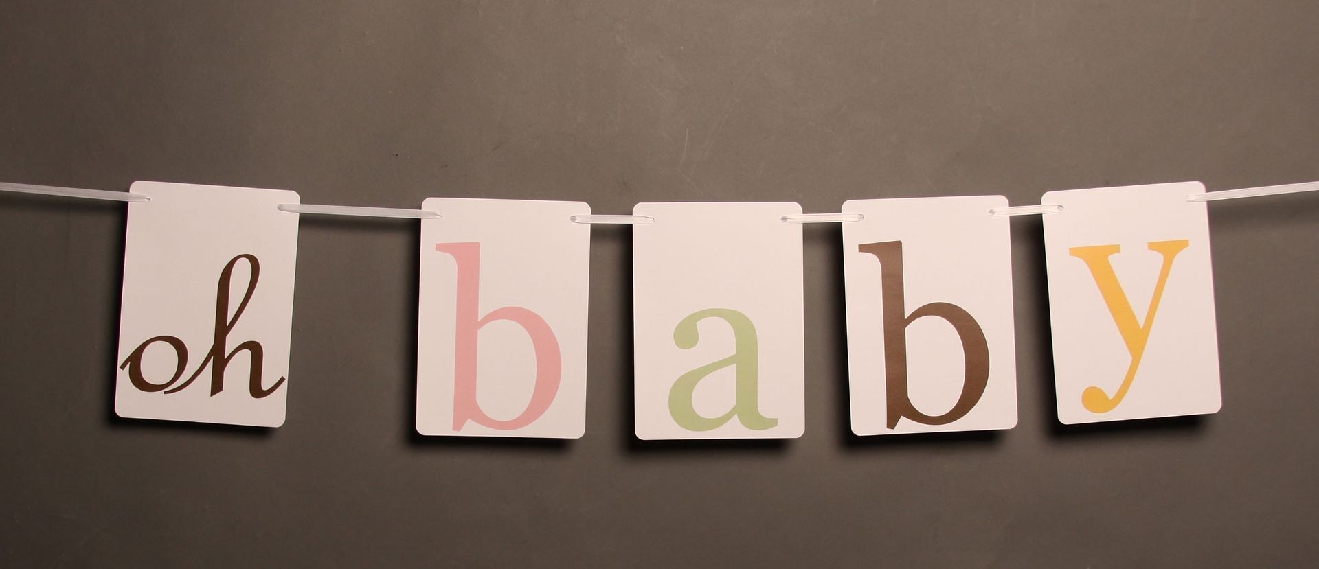 Oh Baby party banner for a baby shower doubles as nursery decor