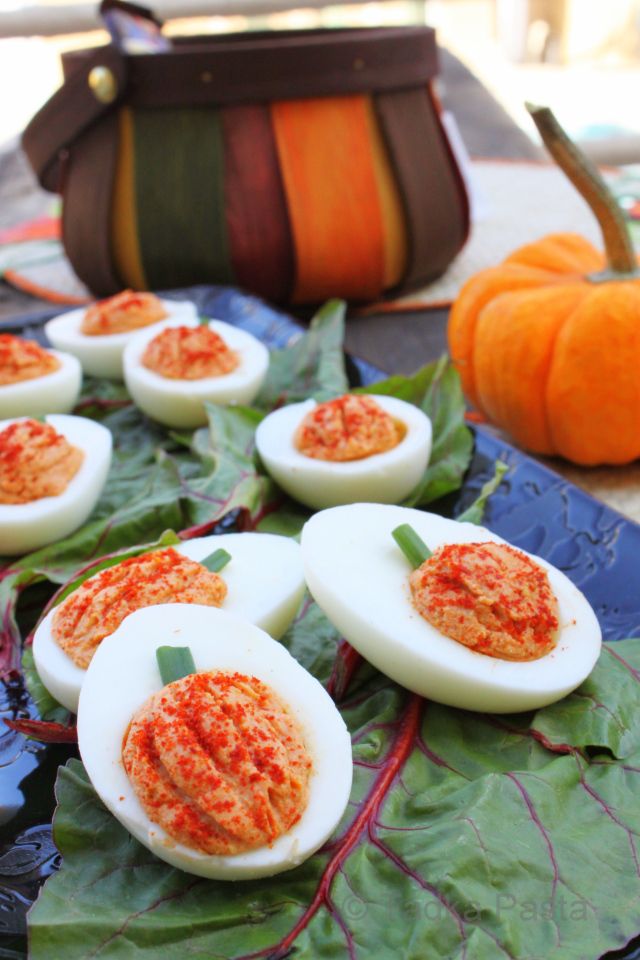 Halloween deviled eggs shaped like pumpkins on Cool Mom Picks