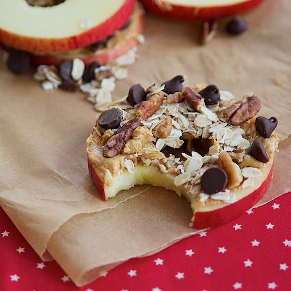 Healthy snacks: apple slices with peanut butter and chocolate